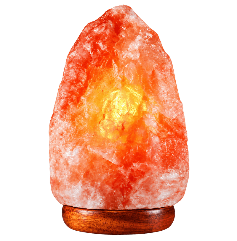 An illuminated pink salt lamp on a wooden base